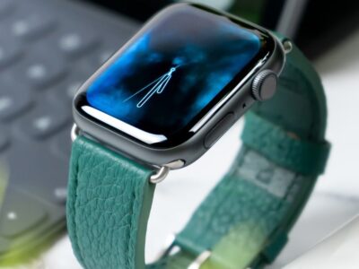 Apple Watch with teal leather band.