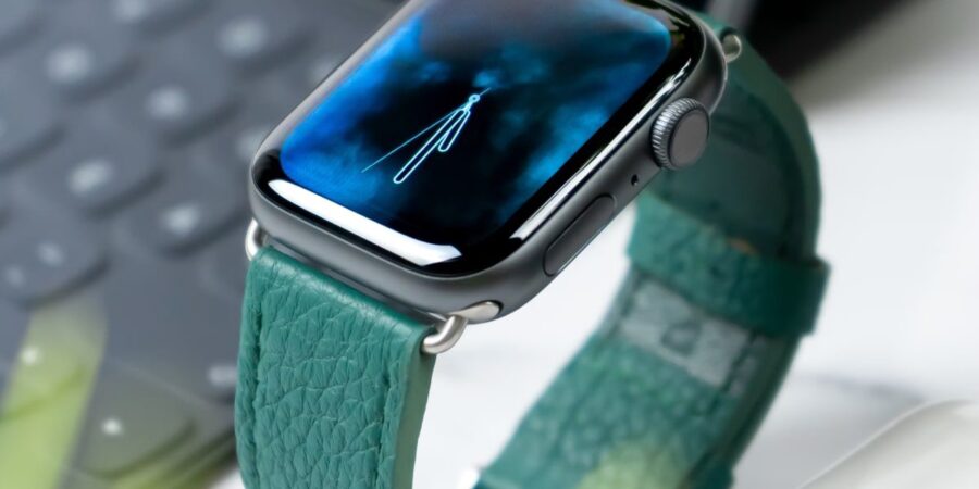 Apple Watch with teal leather band.