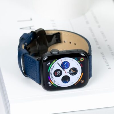 Apple Watch with blue leather band.