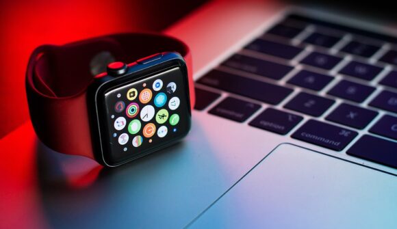 Apple Watch on laptop keyboard.